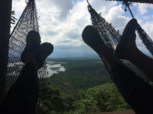 feet up in hammock over Amazon rainforest